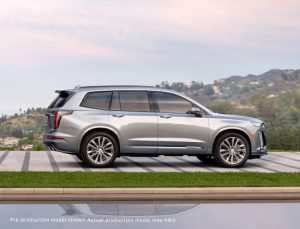 Silver 2019 Cadillac XT6 SUV parked on a driveway overlooking hills
