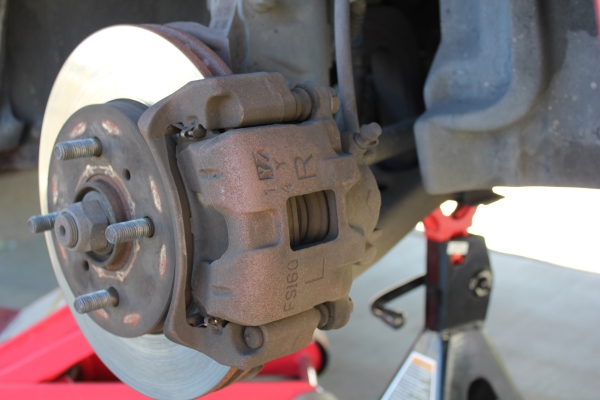 How to Change the Front Brake Pads and Rotors on a 2004 Mitsubishi Lancer